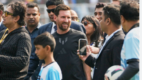 Massive crowd of football fans in Kolkata wearing Argentina jerseys waiting for Messi.